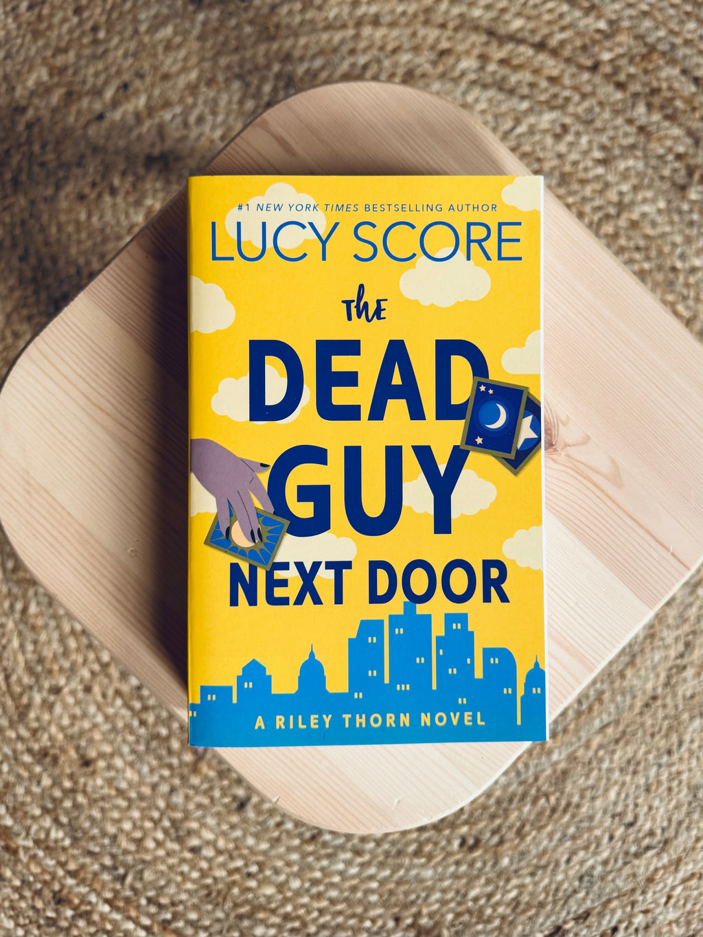 Dead Guy Next Door by Lucy Score
